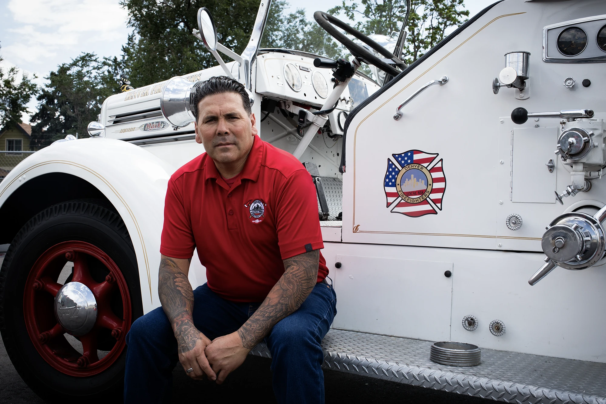 Local 858 Chris website detail web Chris Ferguson, president of Denver Fire Fighters Local 858 poses on an antique fire truck for the lawsuit Denver Fire Fighters Local 858 v. Colorado Professional Fire Fighters & IAFF