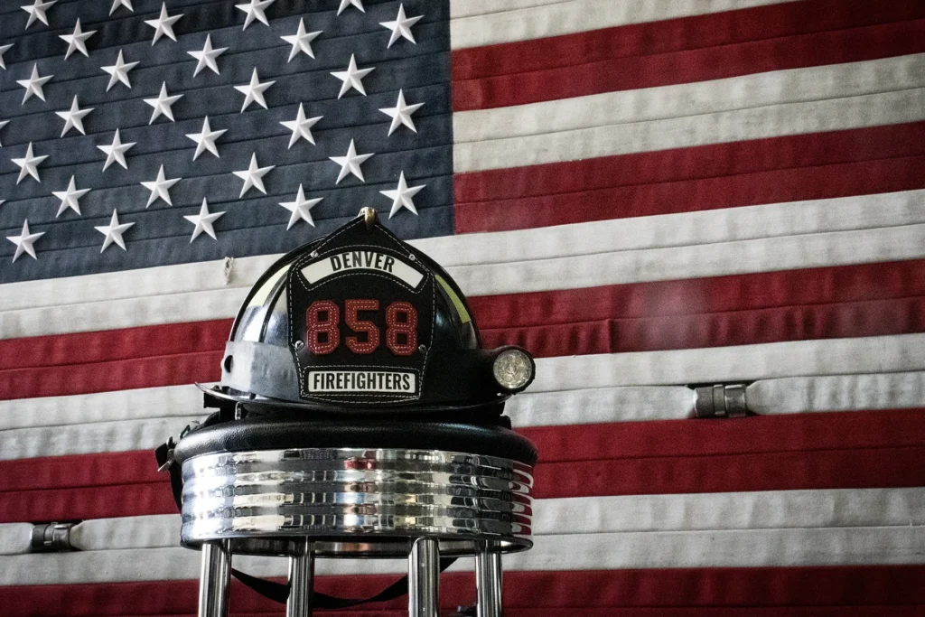 Denver Fire Fighters Local 858 helmet before an American flag