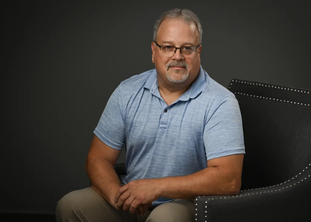 Chris Taylor sitting on a chair
