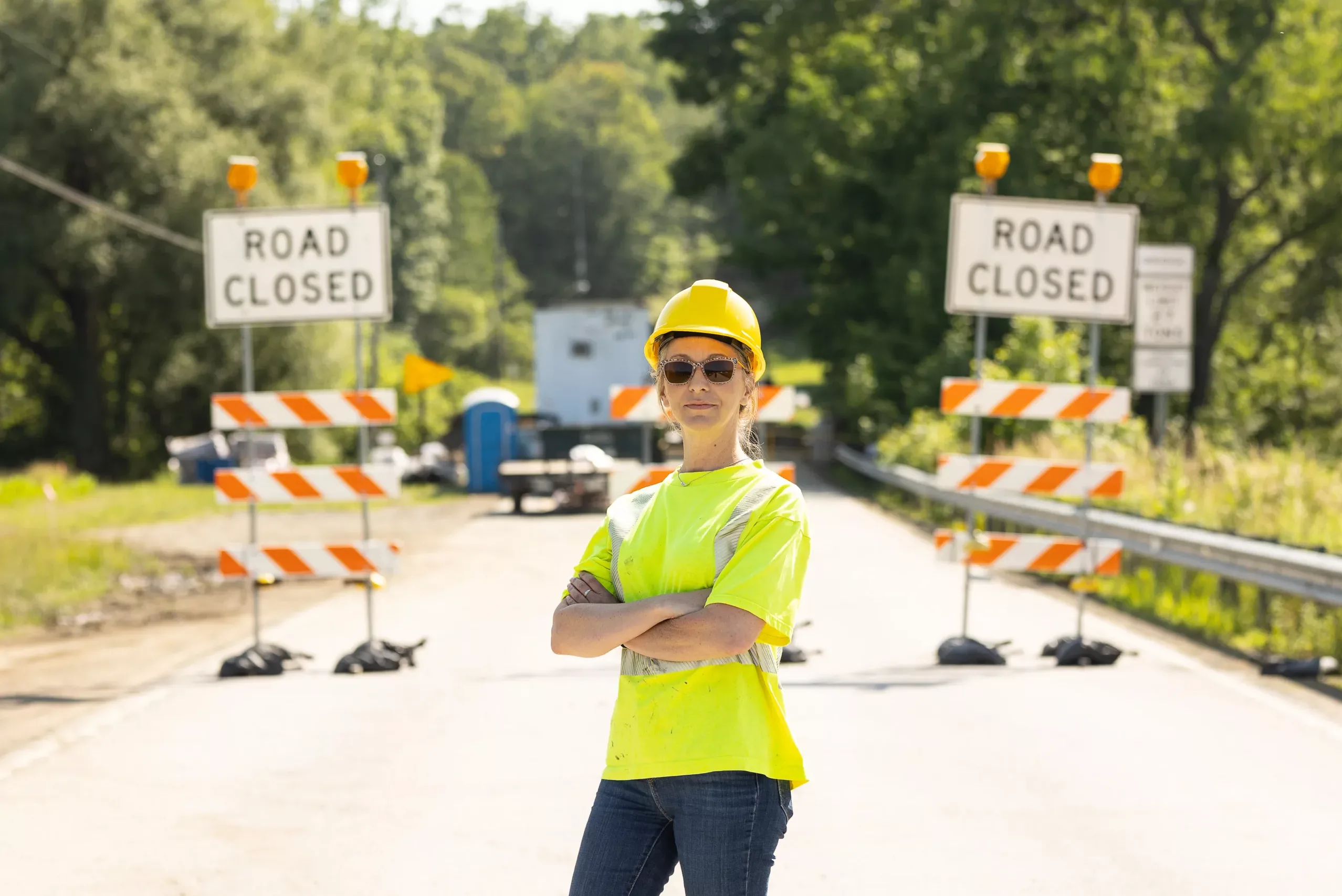 Mindy_McFetridge_9456 Mindy McFetridge, plaintiff in McFetridge v. AFSCME, Council 13, standing in front of road construction with her arms crossed.