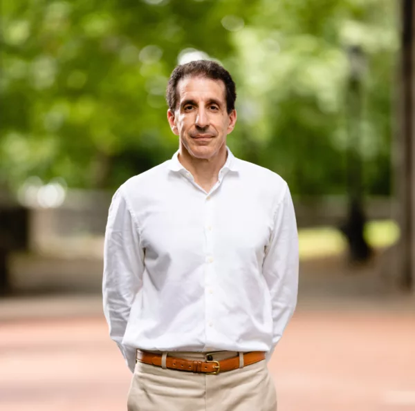 Glen Wilkofsky, plaintiff in Wilkofsky v. American Federation of Musicians, Local 45, standing on a tree-lined path with his hands behind his back.