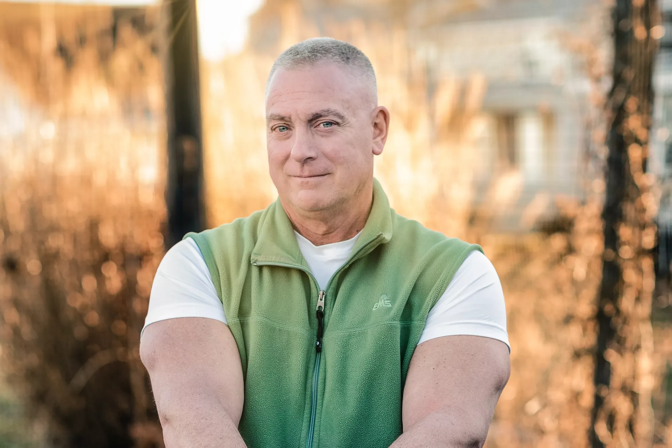 Grande_INT John Grande, plaintiff in Grande v. HFT, smiling in front of a field of tall grasses.