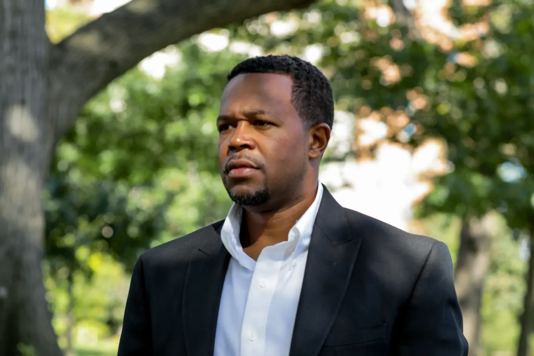 Ed Seabron, plaintiff in Seabron v. AFSCME, D.C. 37, standing on a park path.