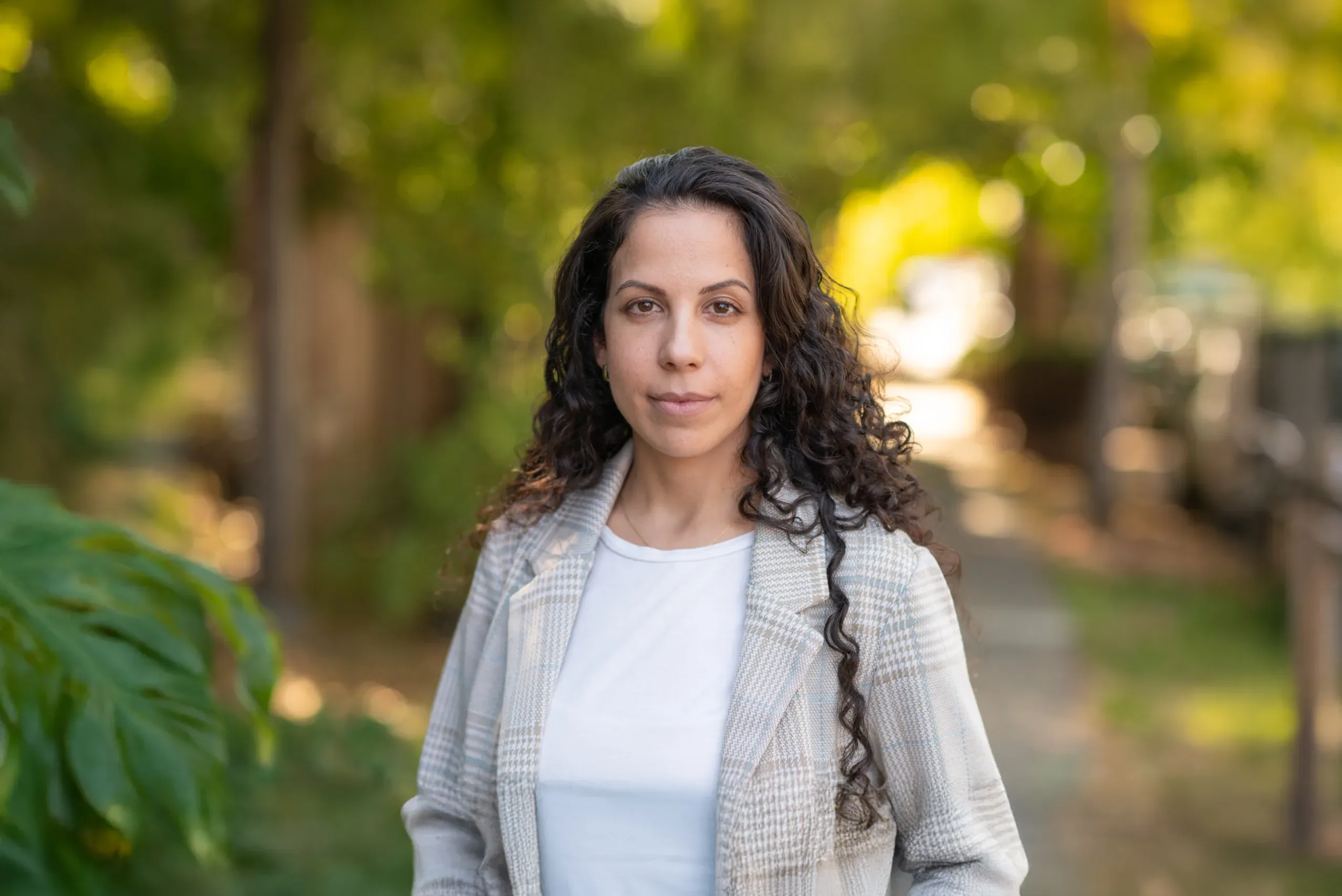 Yaniv_expanded Our client Karin Yaniv, an Israeli postdoc at UC Berkeley suing her union for anti-Semitism, smiling under a tree-lined street.