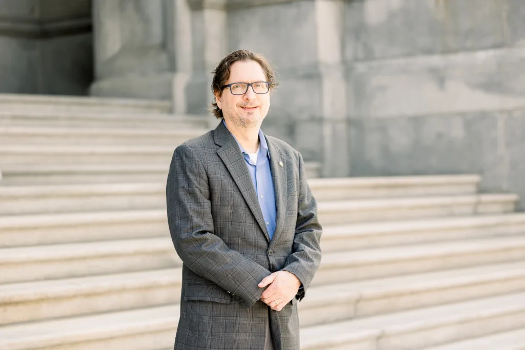 Todd Burns, plaintiff in a lawsuit, stands on the Pennsylvania Capitol steps.