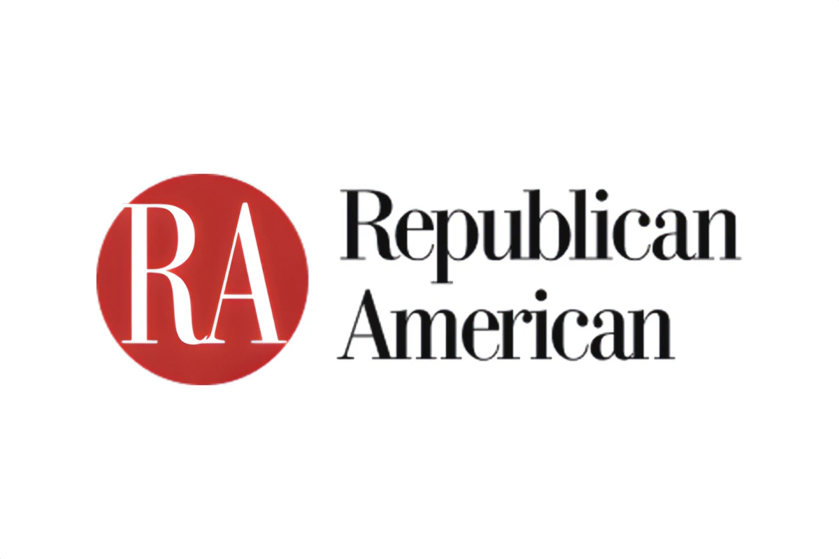 The logo of the Republican American newspaper; black text and red circle on white background